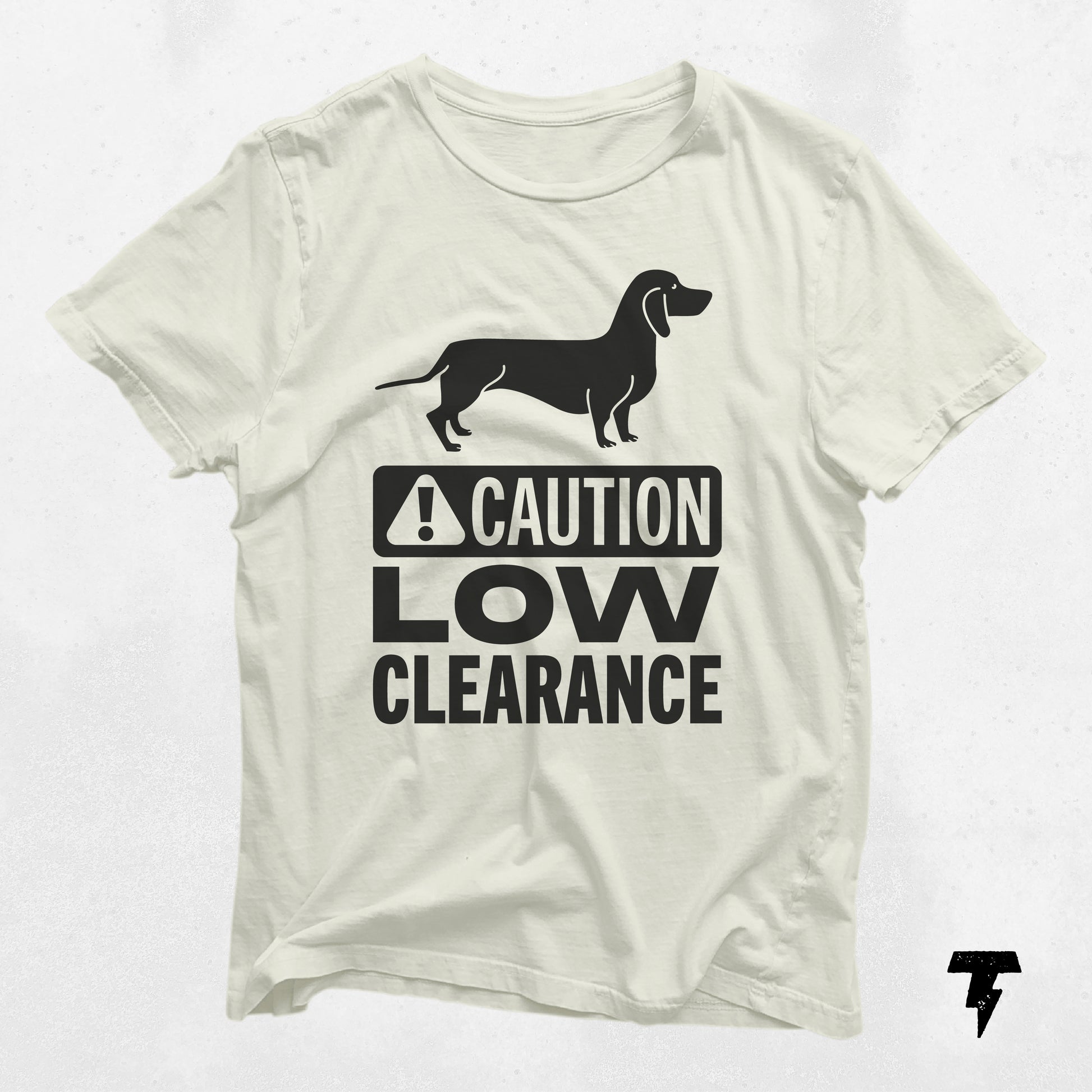White dachshund shirt with 'Caution Low Clearance' print, cute gift for dog moms, unisex and made from soft cotton.