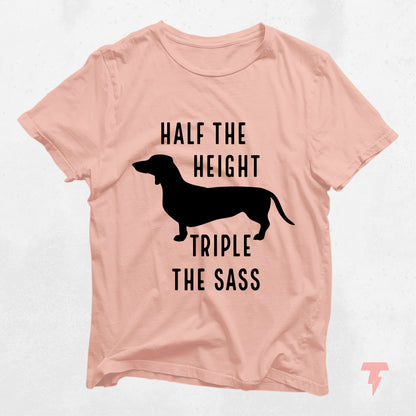 Peach Dachshund shirt with 'Half the Height, Triple the Sass' text, featuring a silhouette of a Doxie. Ideal for dog moms.
