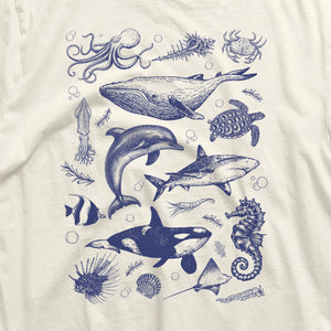 a white t - shirt with blue ink drawings of sea animals