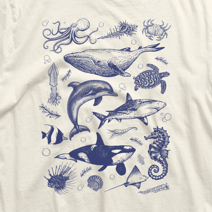 Vintage Ocean Life Shirt featuring orca, whale, dolphin, shark, octopus, turtle, and seahorse illustrations, made with breathable cotton.