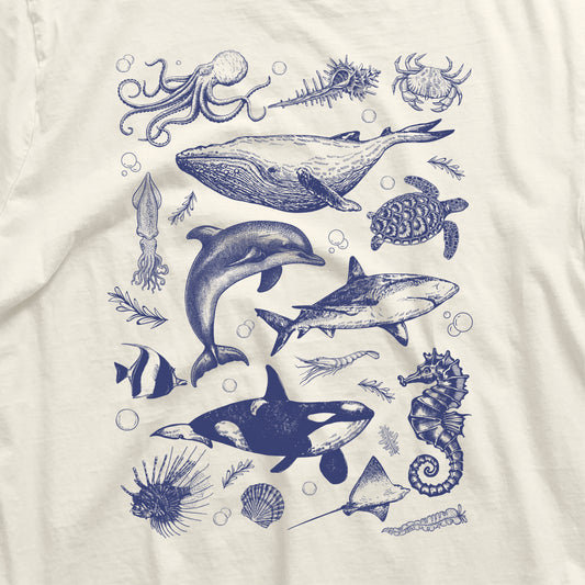 Vintage Ocean Life Shirt featuring orca, whale, dolphin, shark, octopus, turtle, and seahorse illustrations, made with breathable cotton.