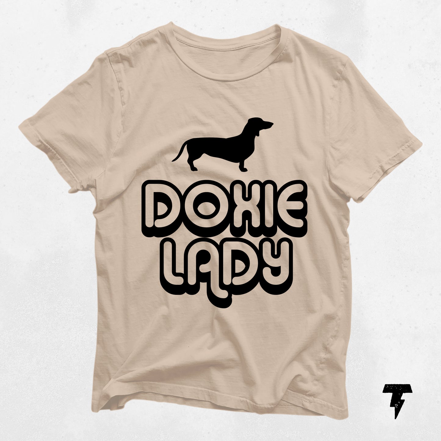 Doxie Lady Dachshund shirt in beige with black print, featuring a dachshund silhouette, perfect gift for dog moms and dachshund fans.