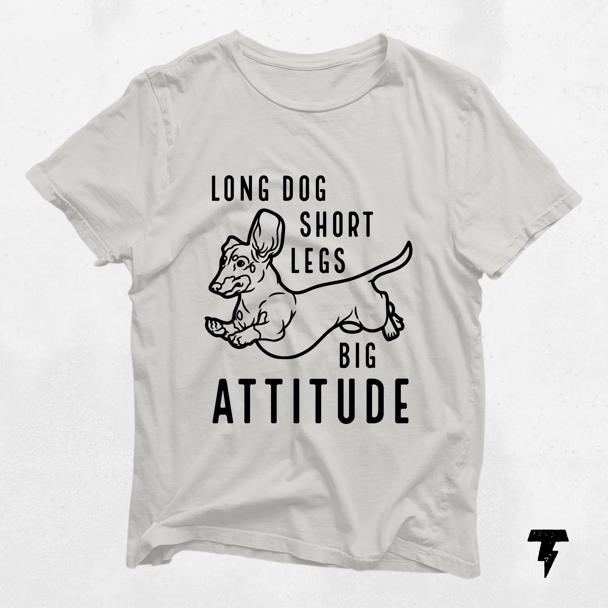 Cream dachshund shirt with "Long Dog Short Legs Big Attitude" text, featuring a fun doxie design. Perfect gift for dog moms and wiener dog lovers.