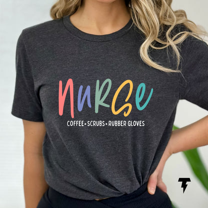 Woman wearing a Nurse T-shirt with colorful 'Coffee Scrubs Rubber Gloves' text, perfect gift for coffee-loving nurses.