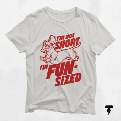 White Dachshund t-shirt with 'I'm not short, I'm fun-sized' slogan in red text, perfect dog lover gift.