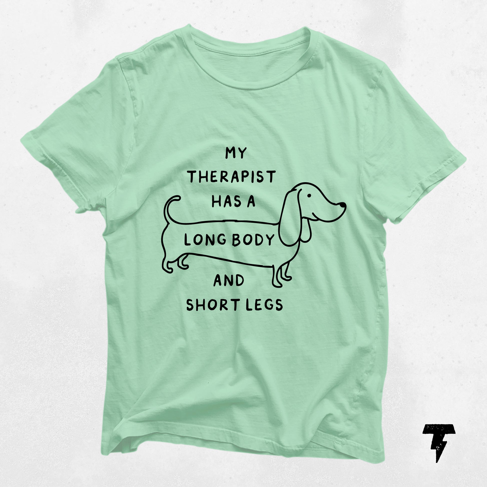 Mint green dachshund t-shirt with 'My Therapist Has a Long Body and Short Legs' text, perfect gift for dog moms.