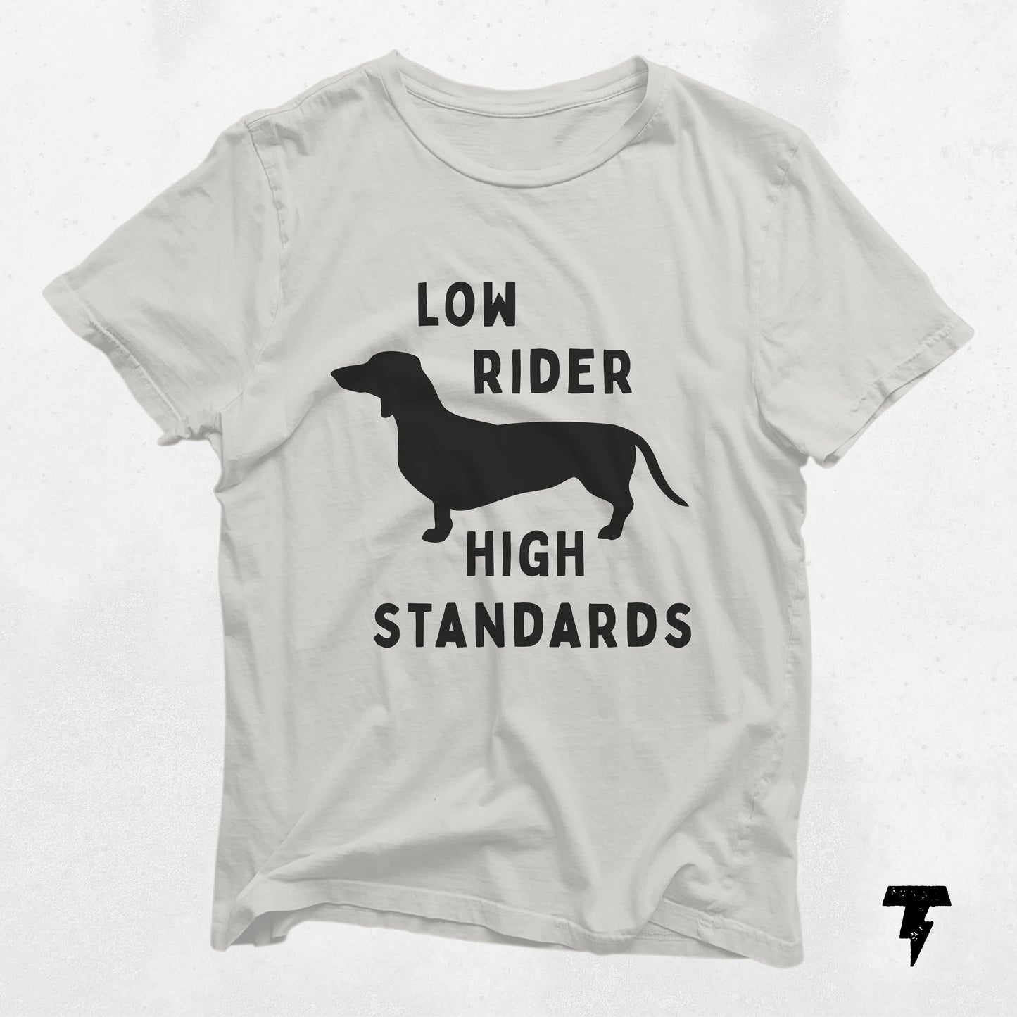White Dachshund shirt with 'Low Rider High Standards' design, perfect gift for dog lovers and moms, featuring a silhouette of a wiener dog.