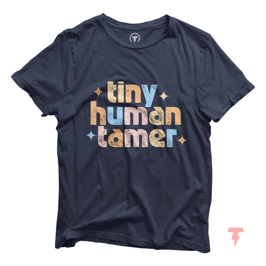 Navy blue t-shirt with "Tiny Human Tamer" in colorful text, perfect for pre-k, kindergarten, and daycare teachers.
