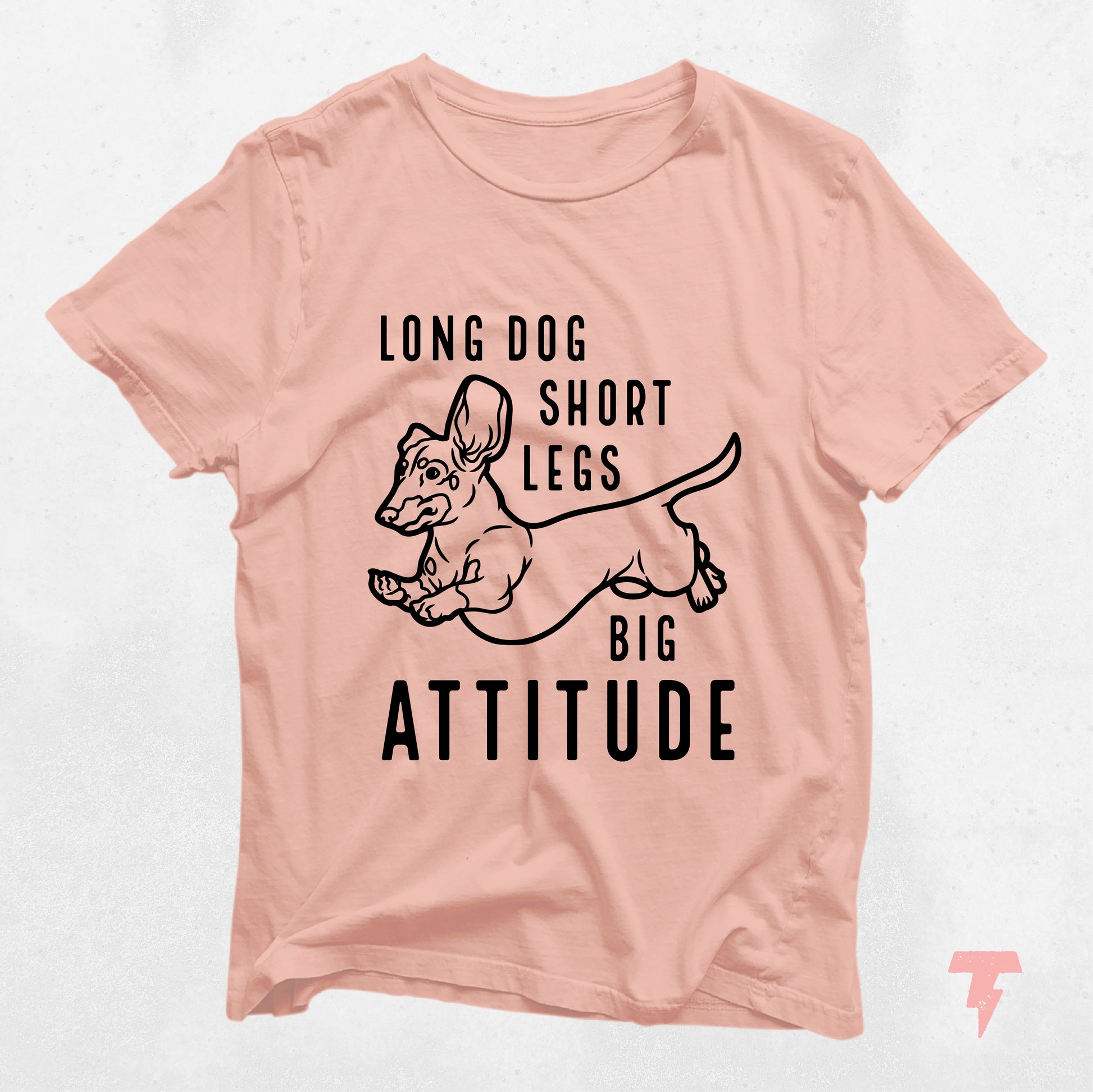 Peach colored dachshund shirt with 'Long Dog Short Legs Big Attitude' text, perfect gift for dog moms and wiener dog lovers.