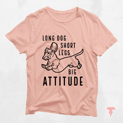 Peach colored dachshund shirt with 'Long Dog Short Legs Big Attitude' text, perfect gift for dog moms and wiener dog lovers.