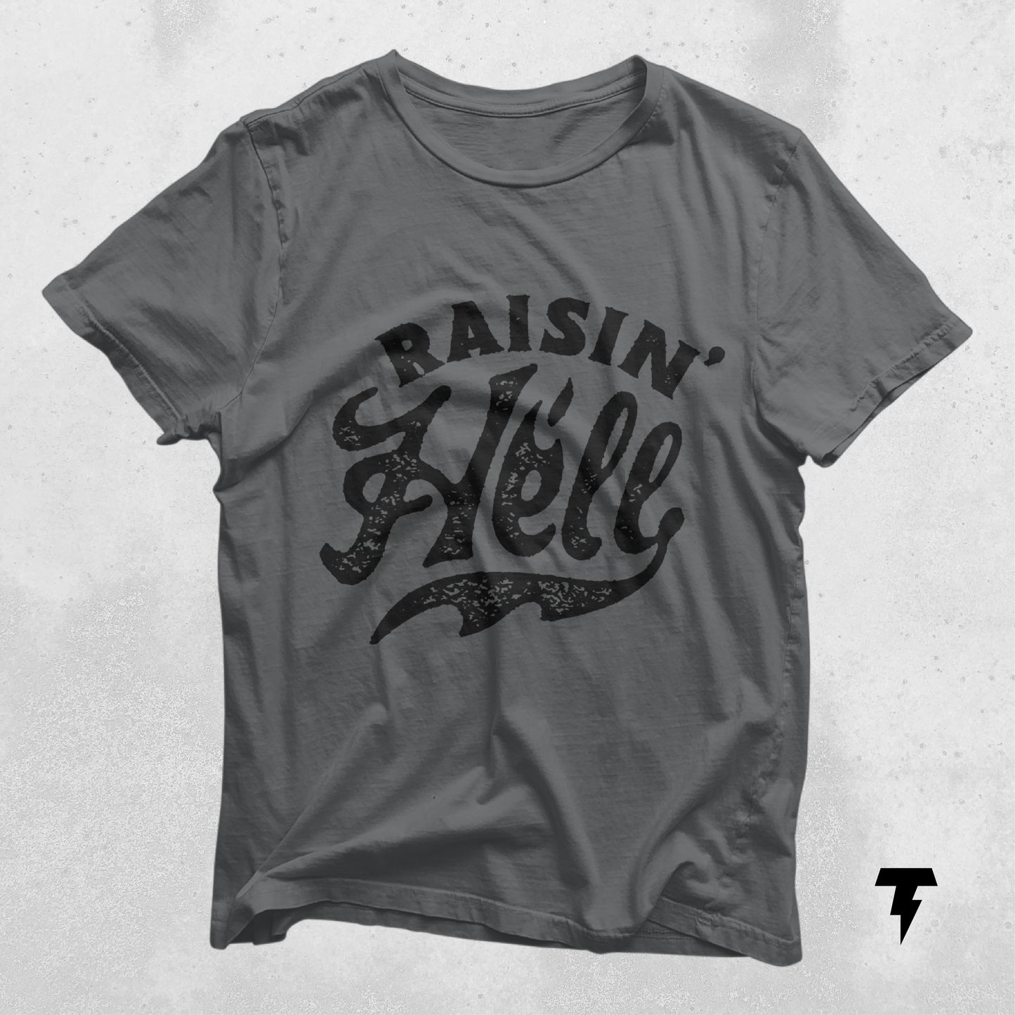 Raising Hell T-Shirt in gray with bold text, perfect for outspoken individuals, made from lightweight cotton with a retail fit.