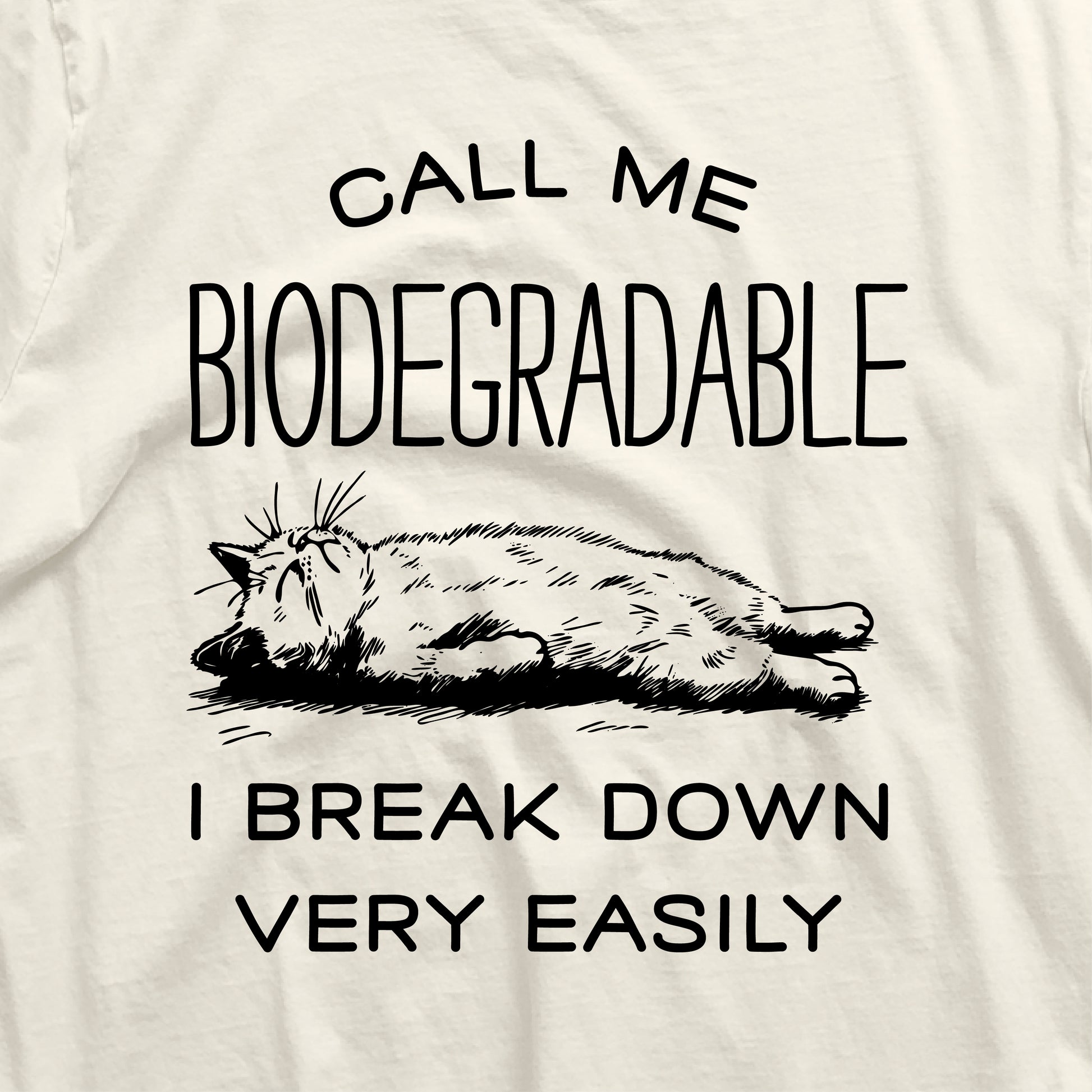 Funny cat shirt featuring a relaxed cat with the text 'Call me Biodegradable, I Break Down Very Easily.' Perfect gift for cat lovers.