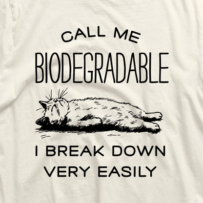 Funny cat shirt featuring a relaxed cat with the text 'Call me Biodegradable, I Break Down Very Easily.' Perfect gift for cat lovers.