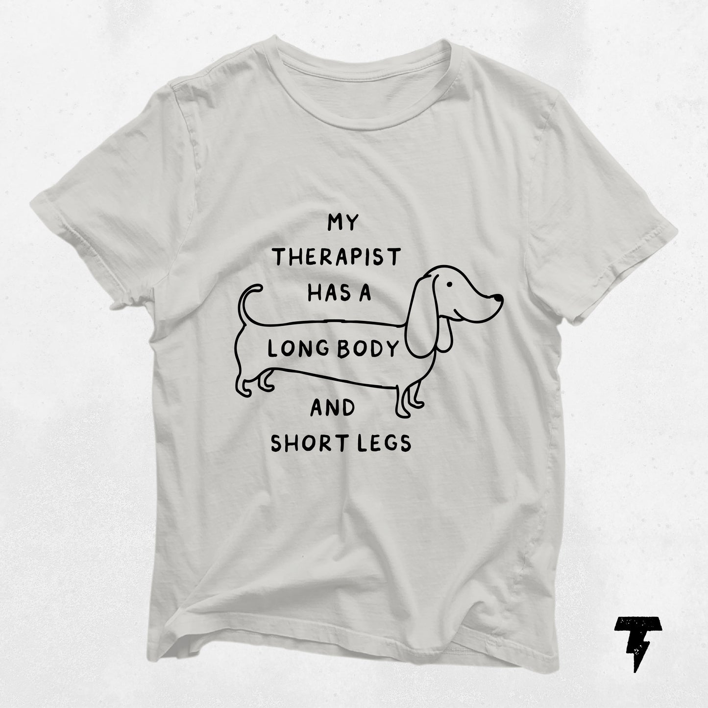 Long body dachshund shirt with 'My therapist has a long body and short legs' text, featuring a cute wiener dog design for dog lovers.