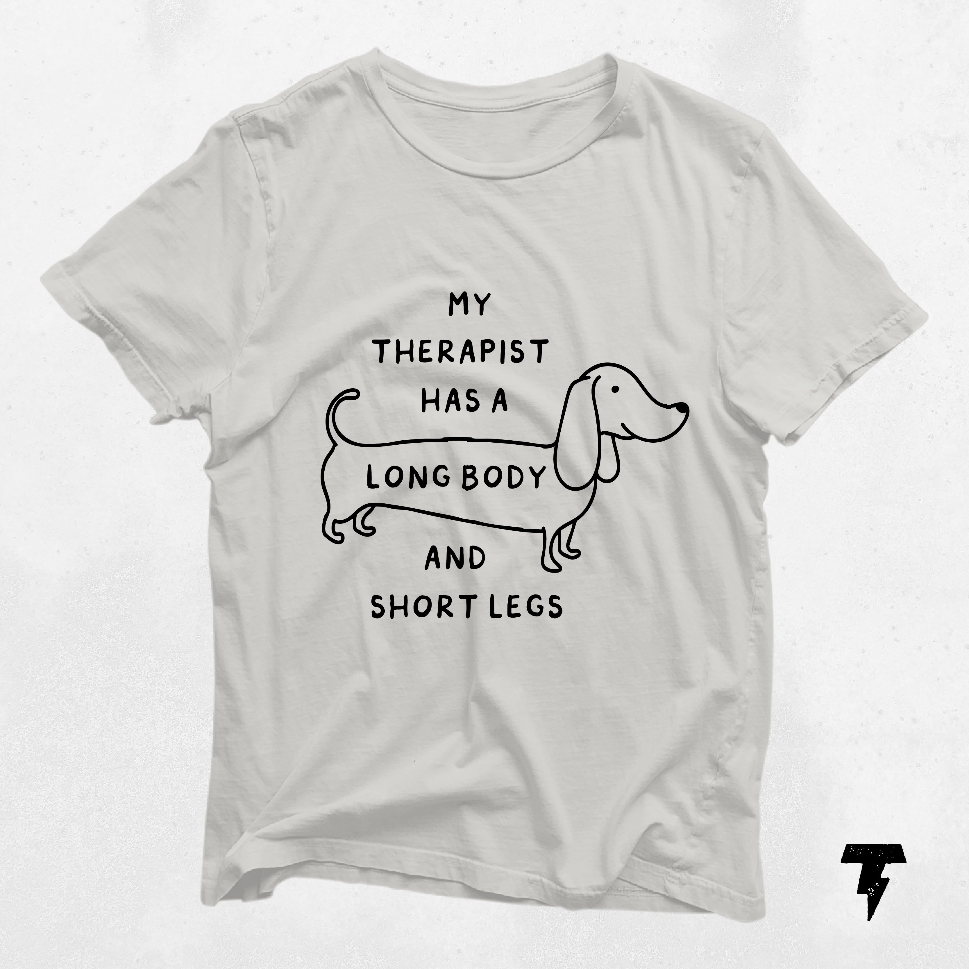 a t - shirt with a drawing of a dog on it