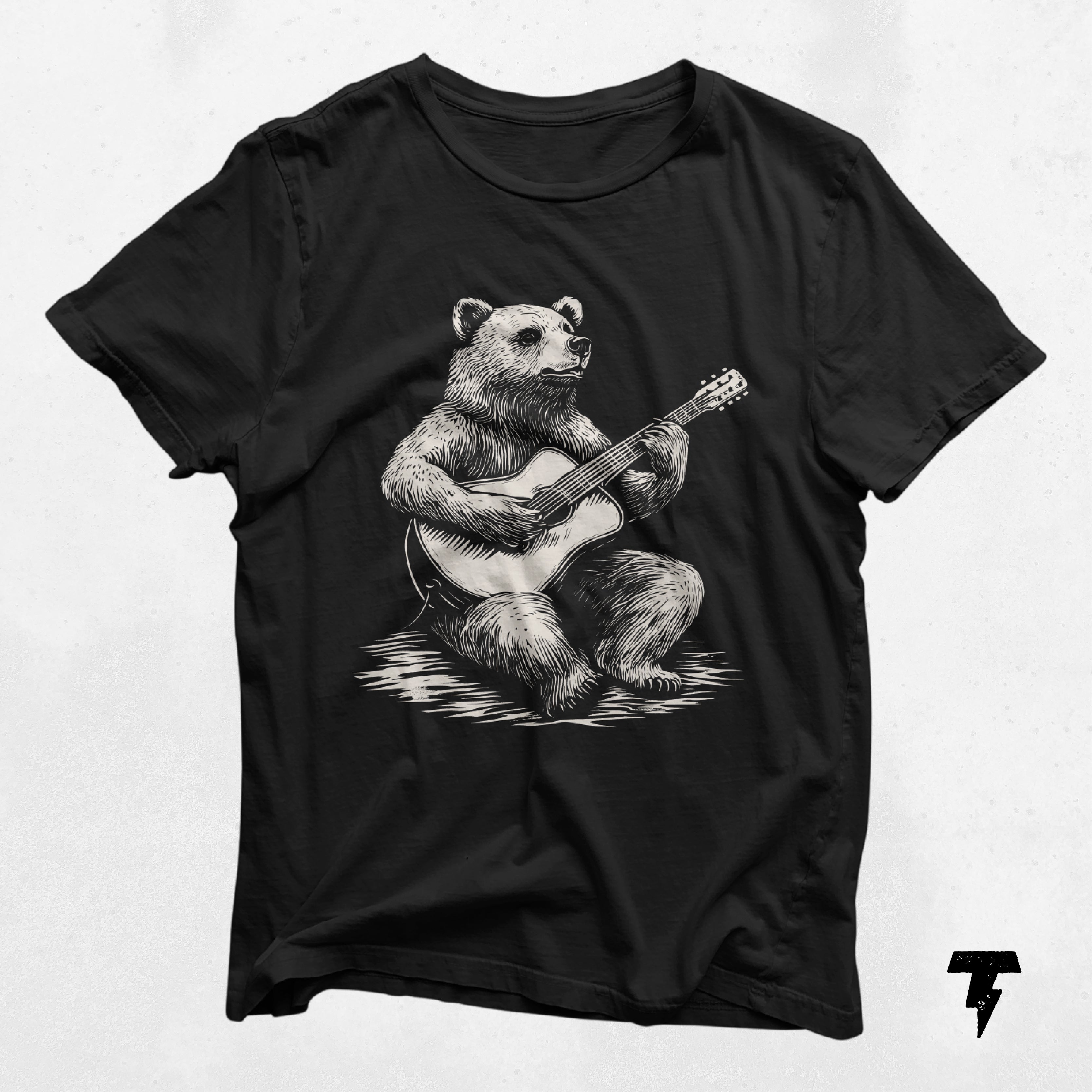 a black shirt with a bear playing a guitar