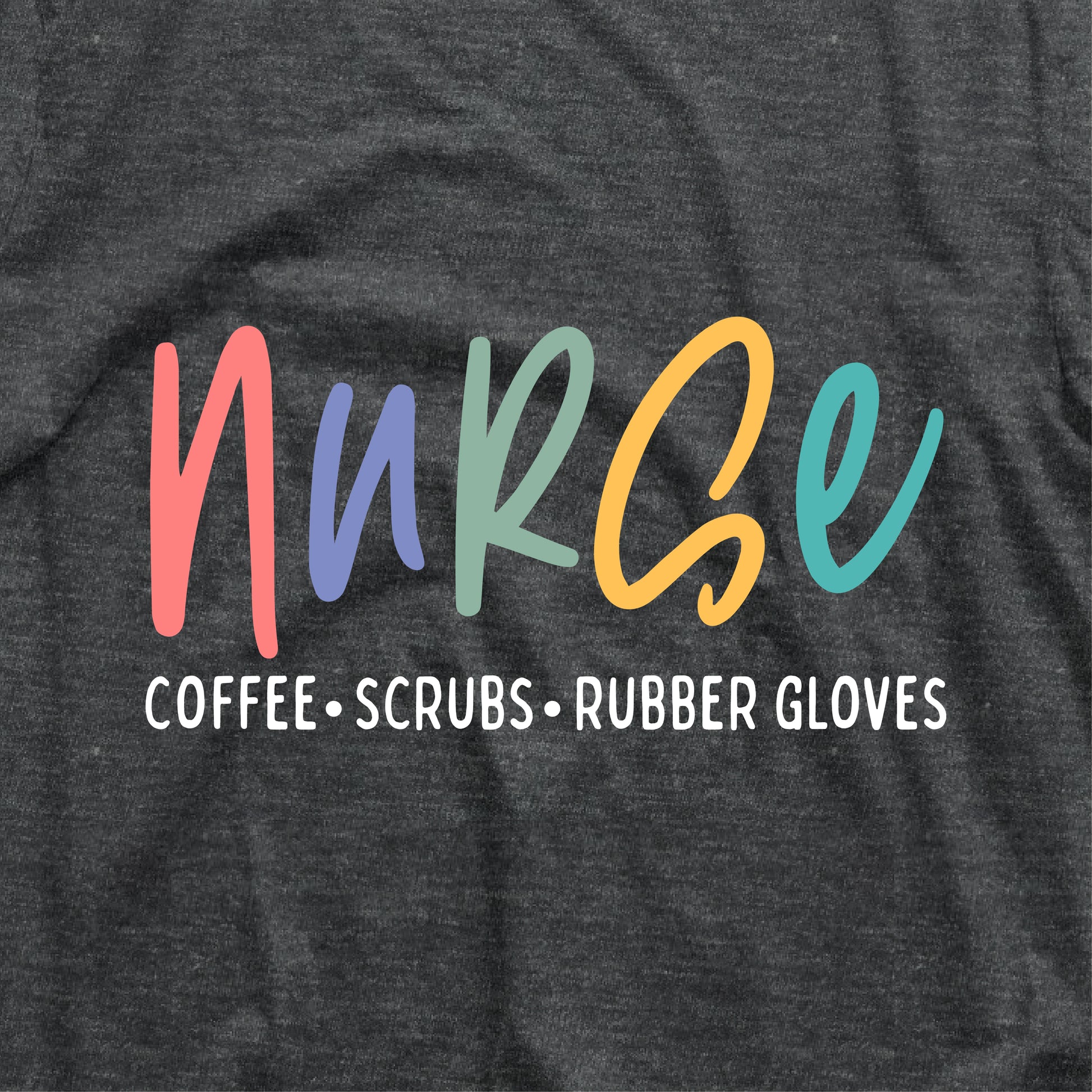Colorful nurse t-shirt design with text 'Coffee, Scrubs, Rubber Gloves' on dark fabric. Perfect gift for coffee-loving nurses.