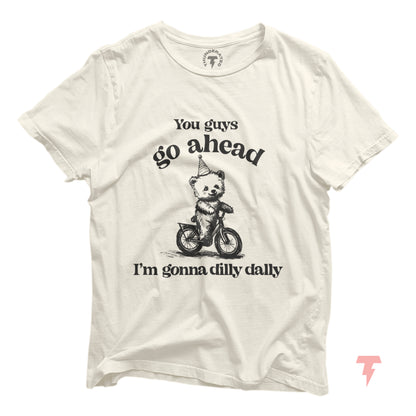 Go Ahead I'm Gonna Dilly Dally T-Shirt with bear riding bike graphic, funny 90s style, unisex cotton tee by Bella+Canvas.