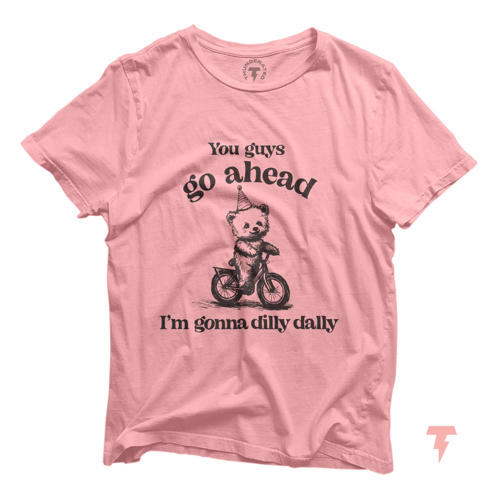 Pink T-shirt with funny bear riding a bike and 'Go Ahead I Am Gonna Dilly Dally' text, perfect for free spirits and hobbyists.