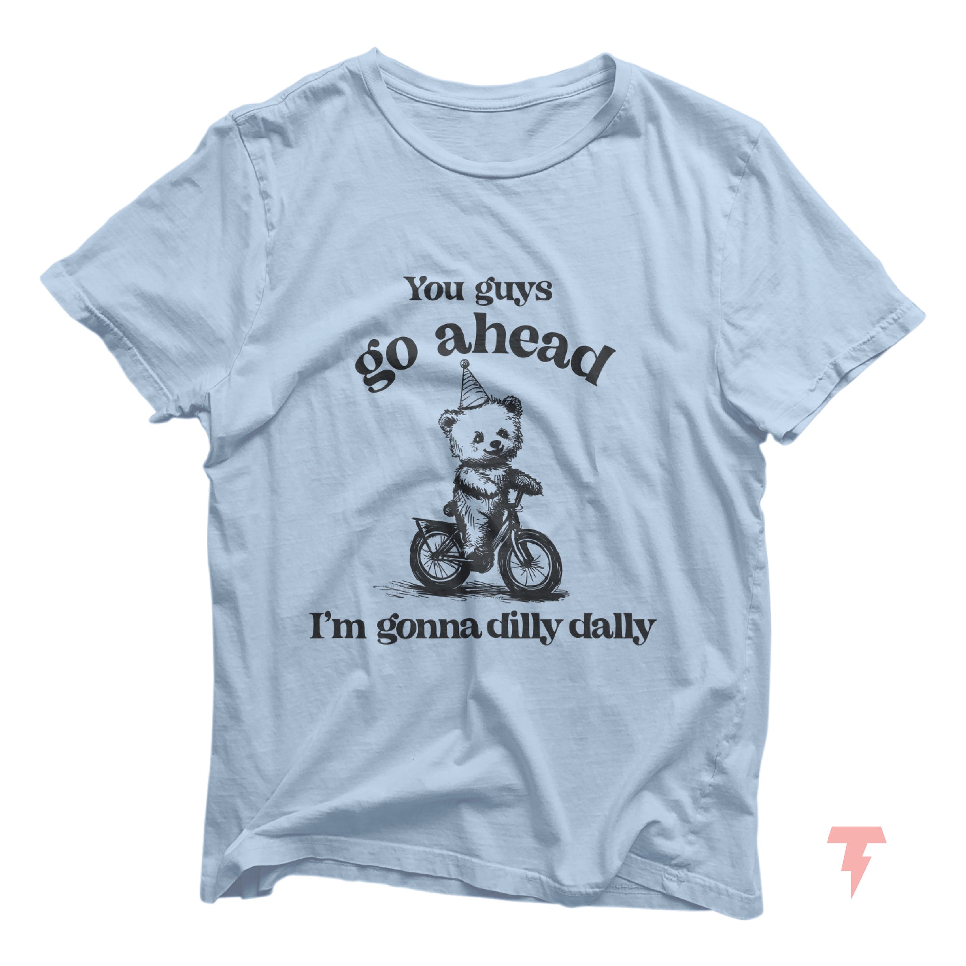 Funny bear riding bike graphic T-shirt with 'Go Ahead I'm Gonna Dilly Dally' sayings in light blue. Perfect for free spirit enthusiasts.