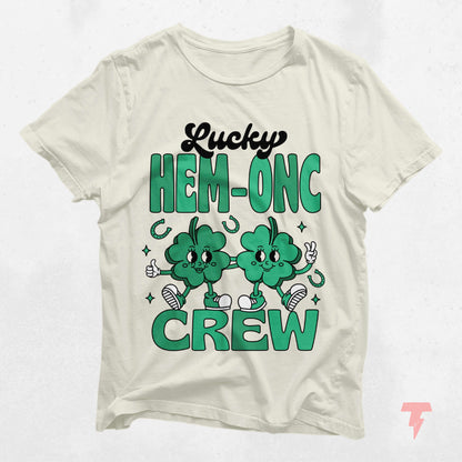 Lucky HEM-ONC Crew St. Patrick's Day shirt for hematology oncology nurses with festive green design and playful shamrocks.
