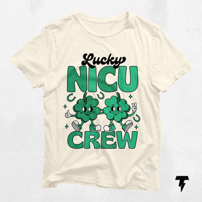 St. Patrick's Day Lucky NICU Crew shirt for NICU nurses with cartoon clovers, celebrating dedication and care.
