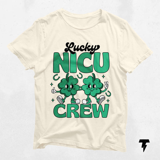 St. Patrick's Day Lucky NICU Crew shirt for NICU nurses with cartoon clovers, celebrating dedication and care.