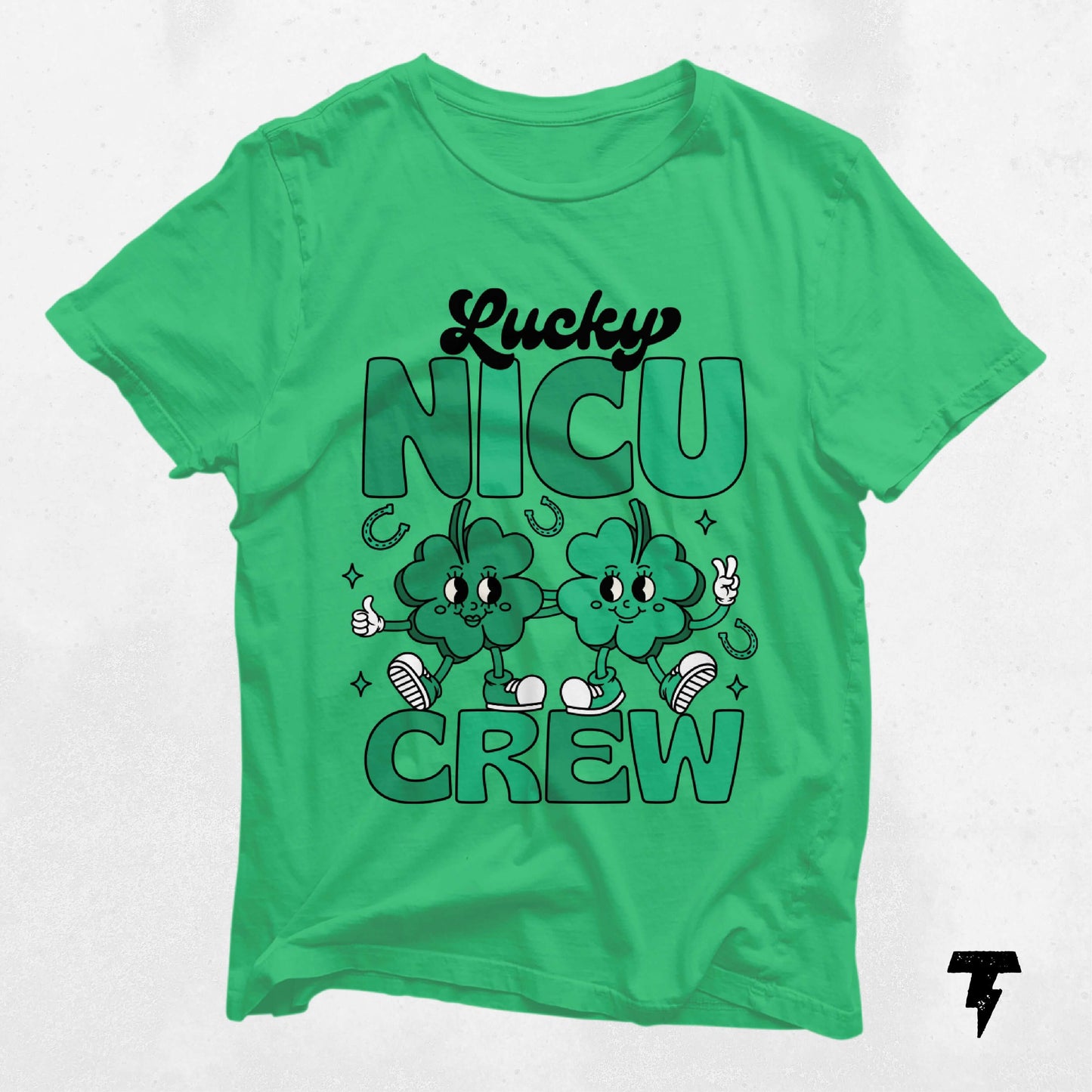 Green St. Patrick's Day Lucky NICU Crew shirt featuring cartoon clovers and playful design, ideal for neonatal nurses.