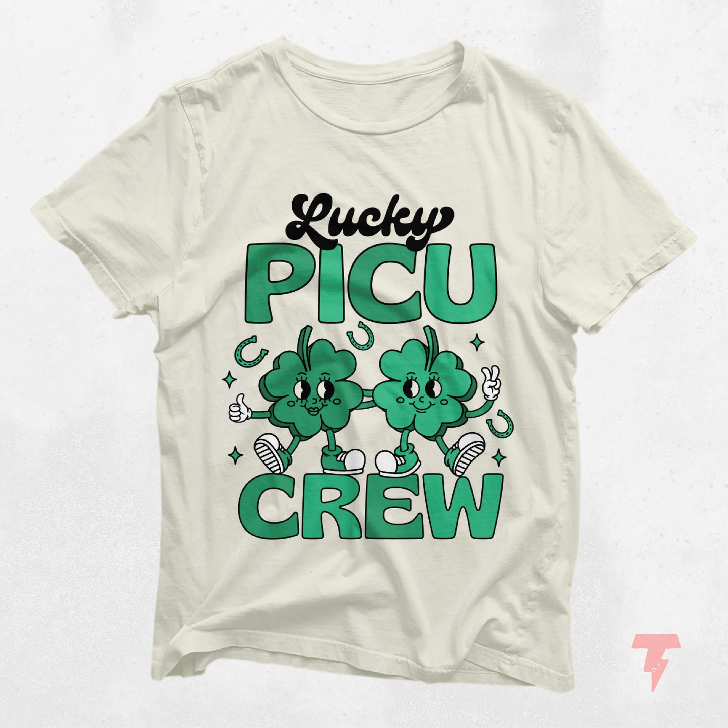 Lucky PICU Crew St. Patrick's Day shirt featuring cartoon clovers for pediatric ICU staff, 100% cotton, perfect gift idea.
