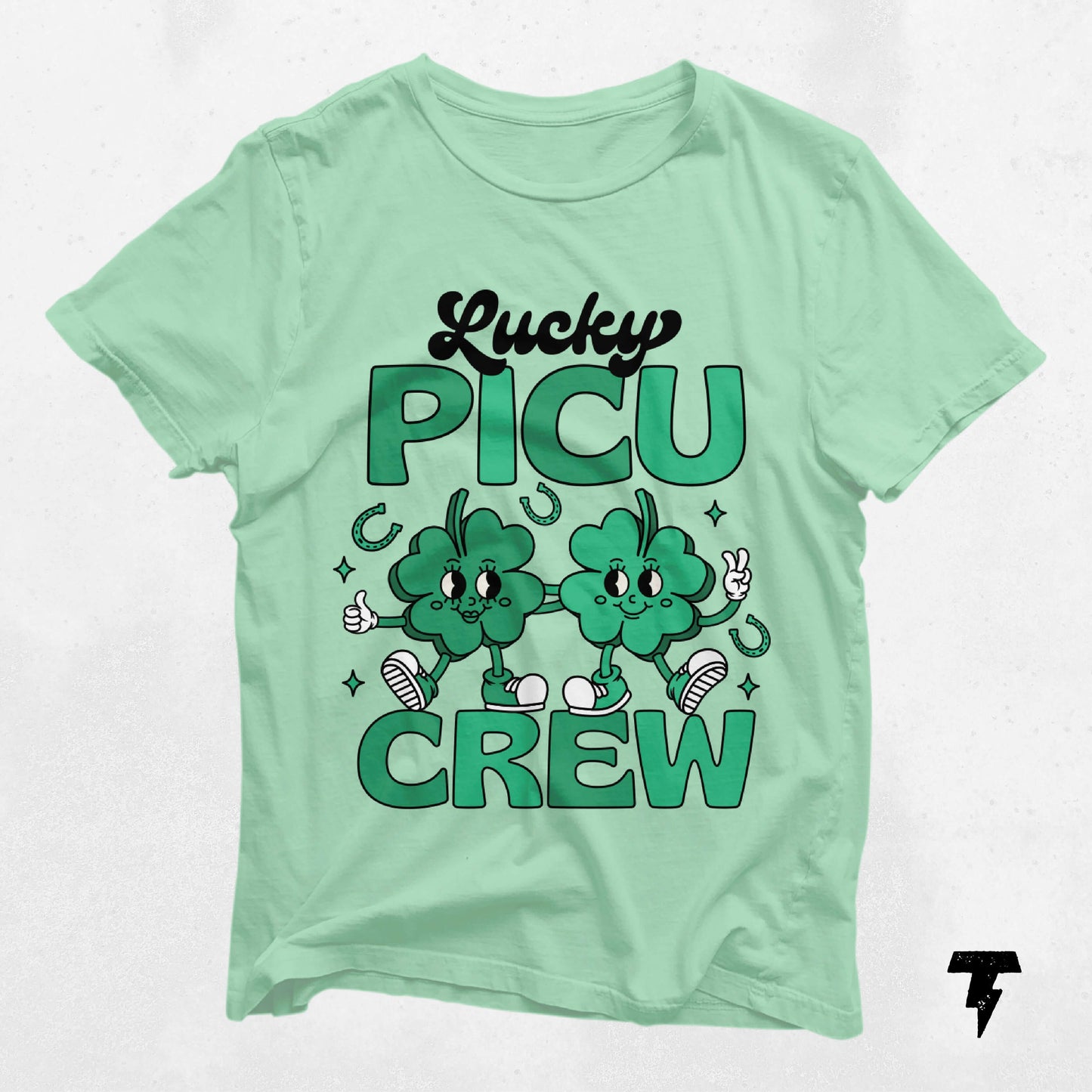 Lucky PICU Crew St. Patrick's Day shirt with clover graphics, perfect for pediatric care professionals. 100% lightweight cotton.