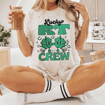 Woman wearing Lucky RT Respiratory Therapist St. Patrick's Day shirt with clover design, holding a coffee.
