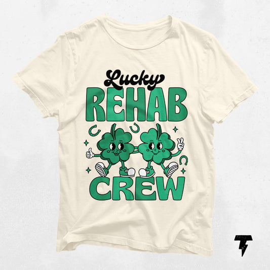 Lucky Rehab Crew St. Patrick's Day shirt featuring green clovers, designed for therapy professionals celebrating with style and comfort.