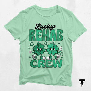 Green Lucky Rehab Crew St. Patrick's Day shirt with shamrock design, ideal for speech, occupational, and physical therapy fans.