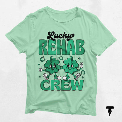 Green Lucky Rehab Crew St. Patrick's Day shirt with shamrock design, ideal for speech, occupational, and physical therapy fans.
