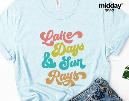 Light blue t-shirt with colorful 'Lake Days & Sun Rays' text, perfect for lake life enthusiasts, featuring vibrant typography.