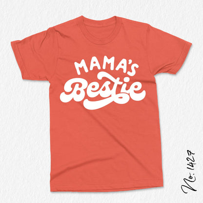 Red t-shirt with white 'Mama's Bestie' text, designed for baby and toddler apparel, ideal for custom shirts and gifts.