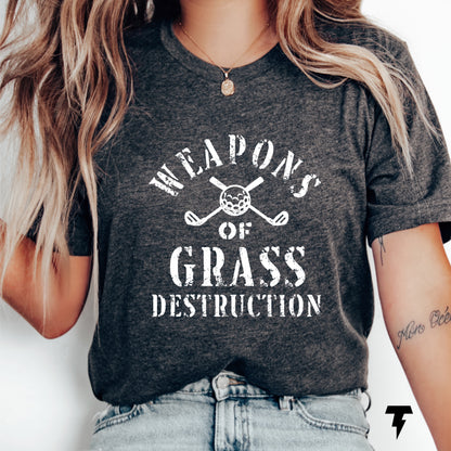 Unisex jersey tee with 'Weapons of Grass Destruction' print, ideal funny golf shirt for golf team. Comfortable, stylish, and breathable.