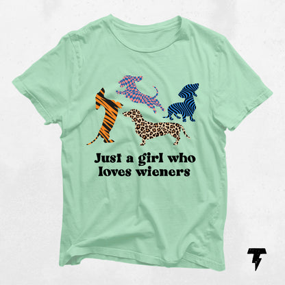 Mint green dachshund t-shirt with colorful dog patterns and 'Just a girl who loves wieners' text, ideal for dog moms.