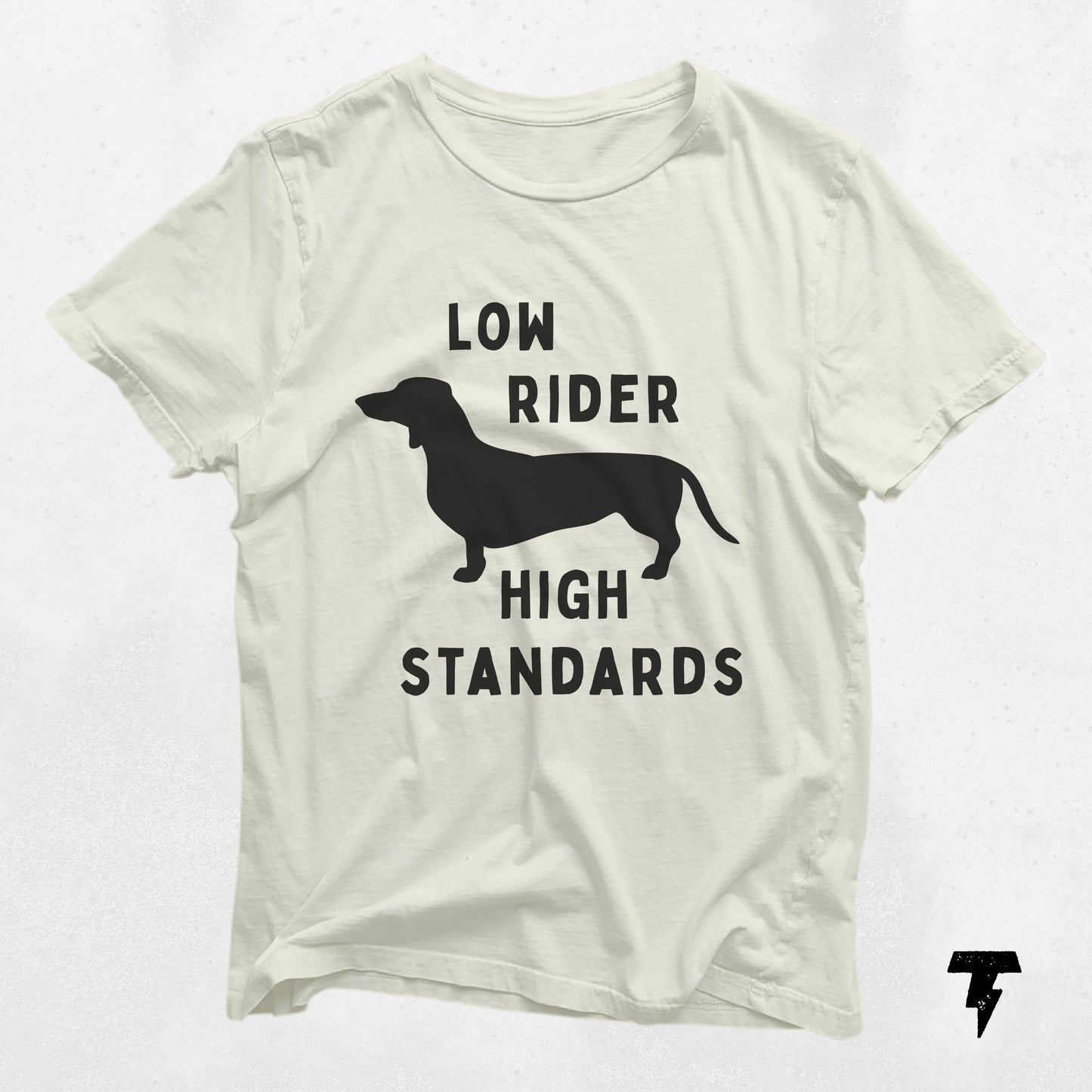 "Low Rider High Standards" dachshund graphic shirt in white, perfect gift for dog moms, made of breathable cotton for casual wear.