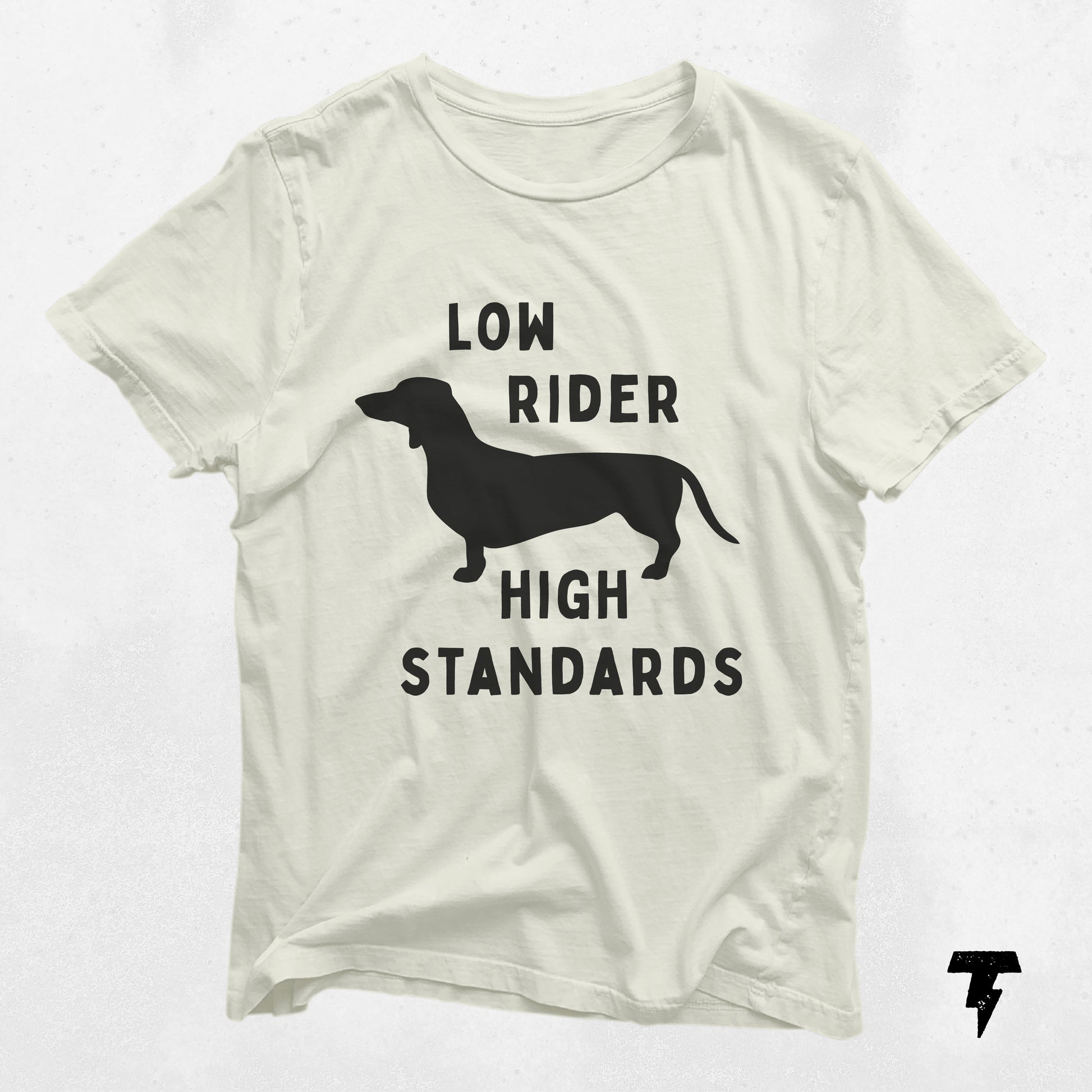 "Low Rider High Standards" dachshund graphic shirt in white, perfect gift for dog moms, made of breathable cotton for casual wear.