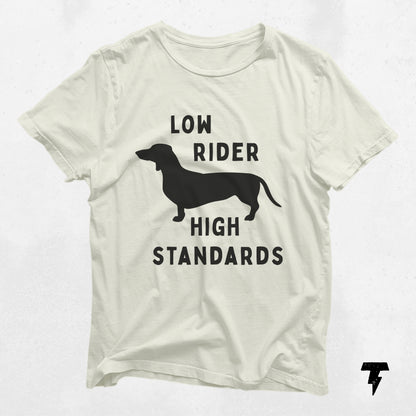 "Low Rider High Standards" dachshund graphic shirt in white, perfect gift for dog moms, made of breathable cotton for casual wear.