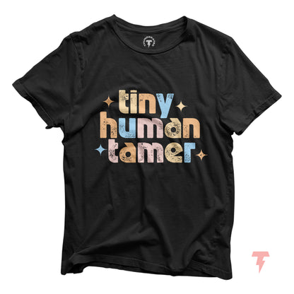 Black "Tiny Human Tamer" t-shirt with colorful text, perfect for pre-k, kindergarten, and daycare teachers.