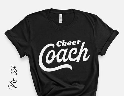 Black Cheer Coach t-shirt with white script design, perfect for cheerleading school spirit and game day fashion.