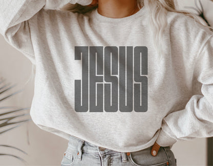 White sweatshirt with bold 'Jesus' graphic design, perfect for religious expression and casual wear.