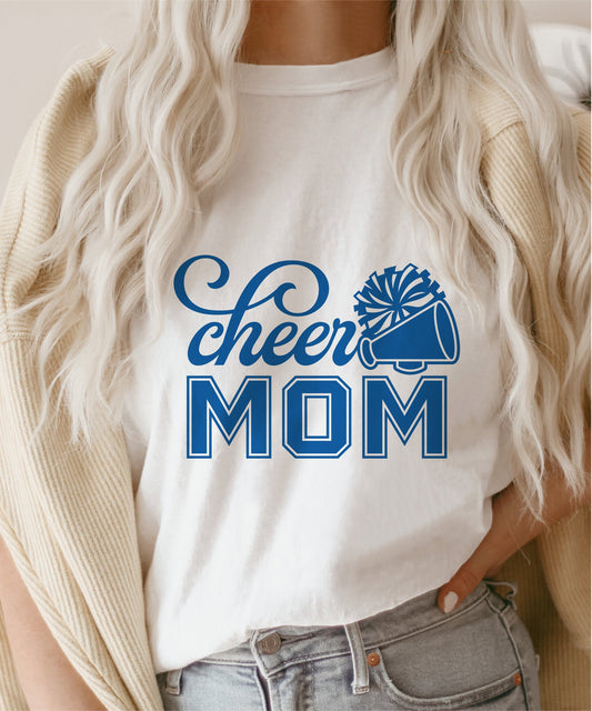 White t-shirt with blue 'Cheer Mom' graphic featuring pom-poms, ideal for cheerleading enthusiasts and sports apparel lovers.