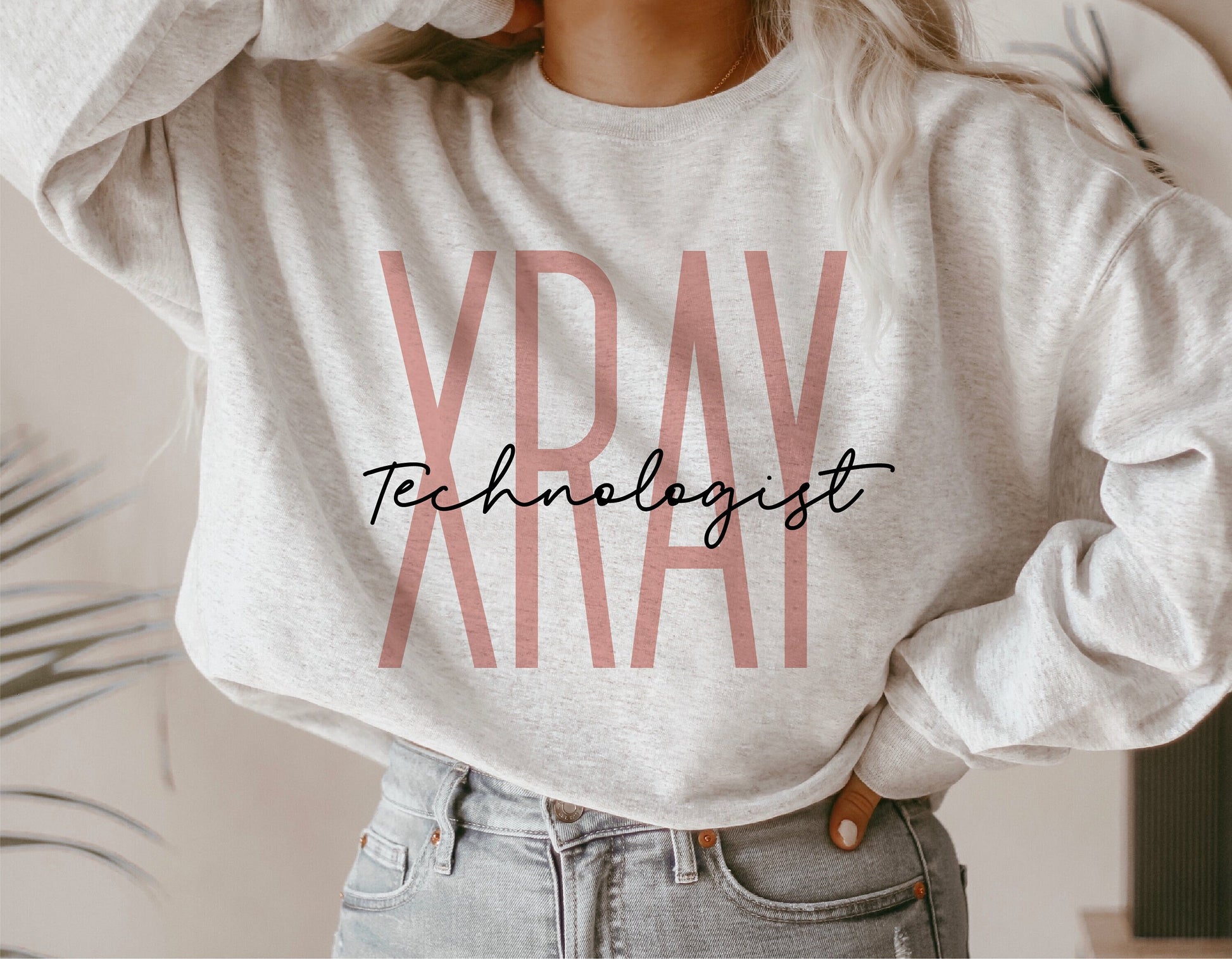 Cozy sweatshirt featuring 'X-Ray Technologist' design, perfect gift for radiologic techs, shown in casual style.