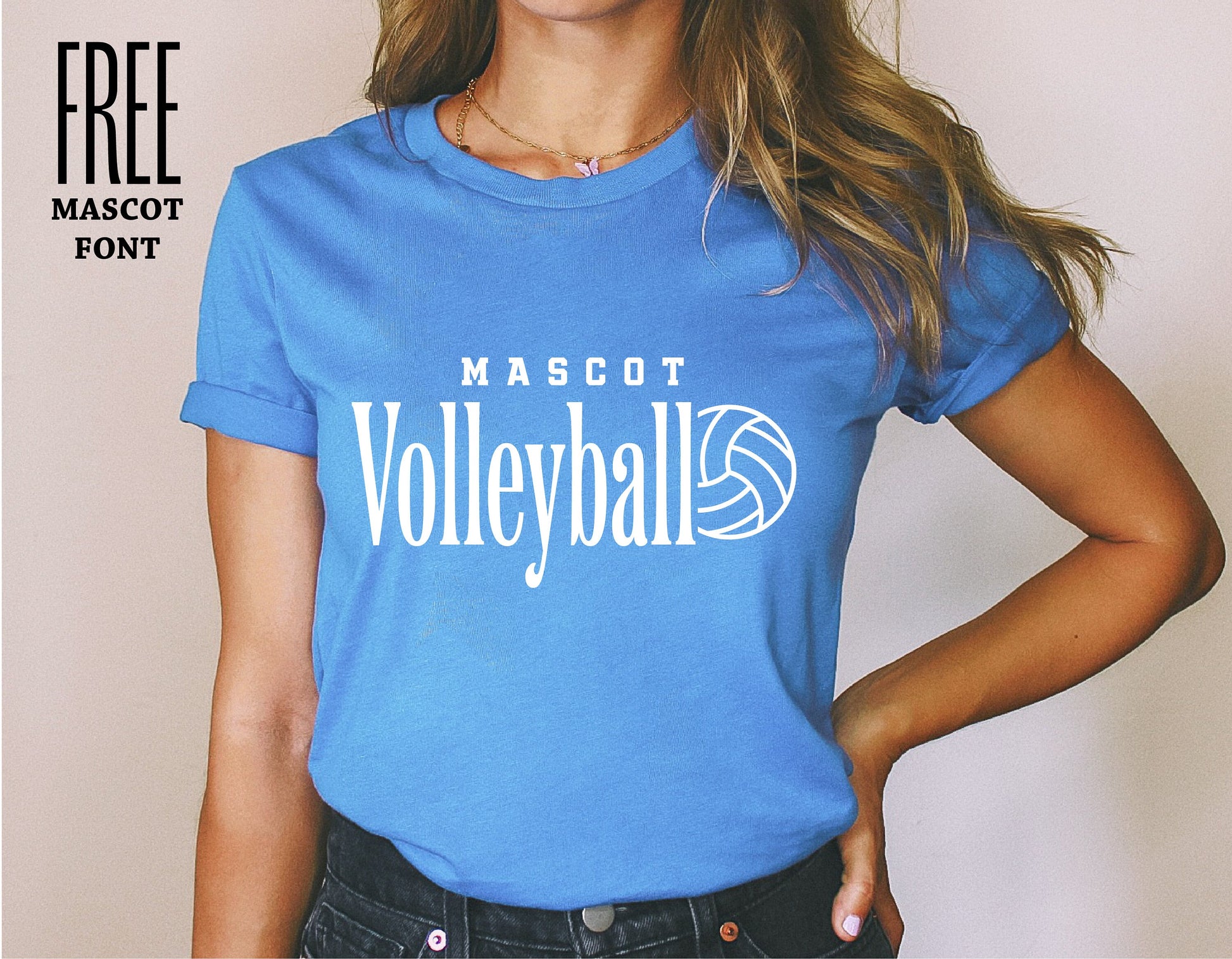 Woman wearing blue t-shirt with 'Mascot Volleyball' logo, showcasing school spirit team apparel design.
