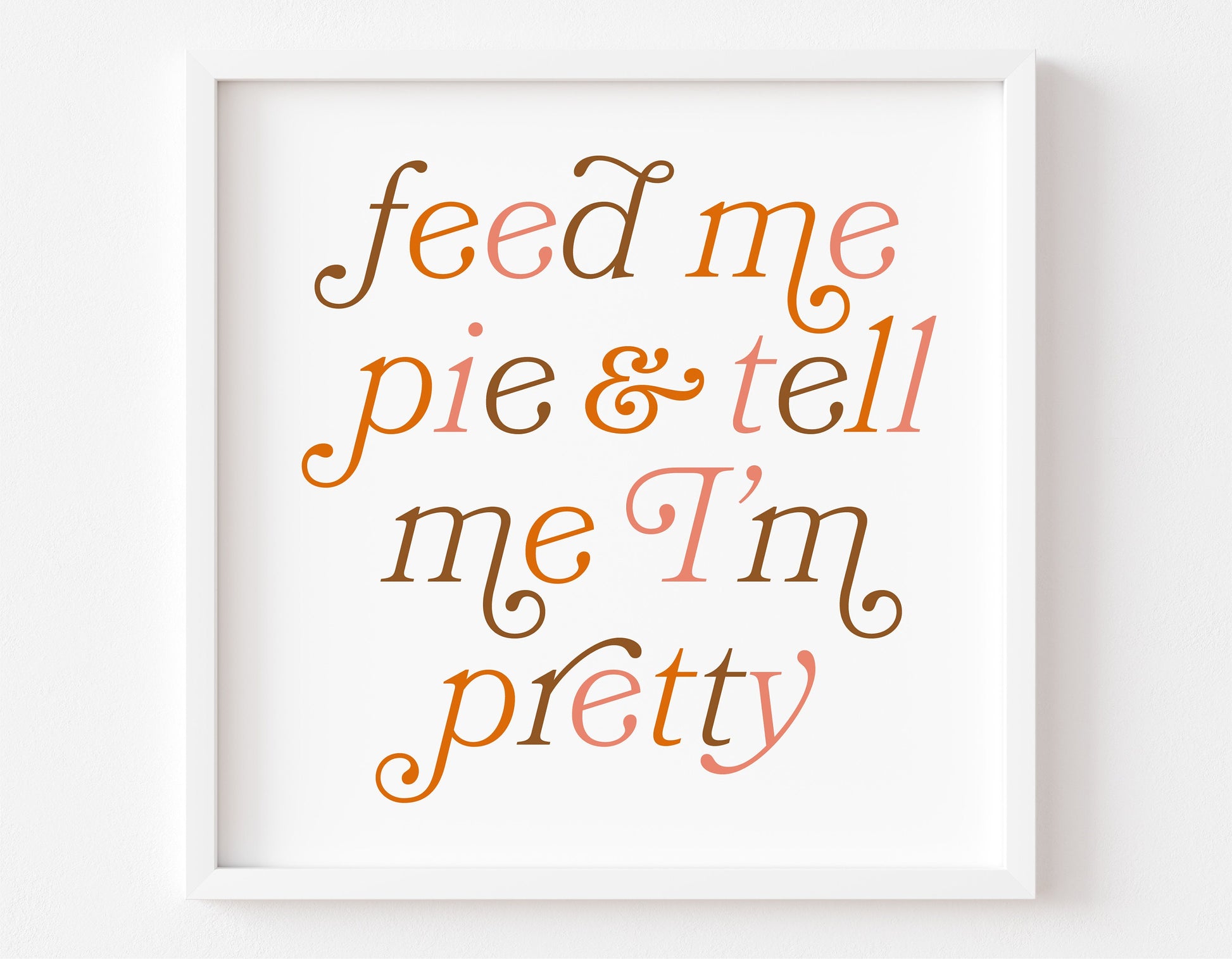 "Feed Me Pie and Tell Me I'm Pretty" autumn-themed typography in a white frame, perfect for Thanksgiving or fall decor.