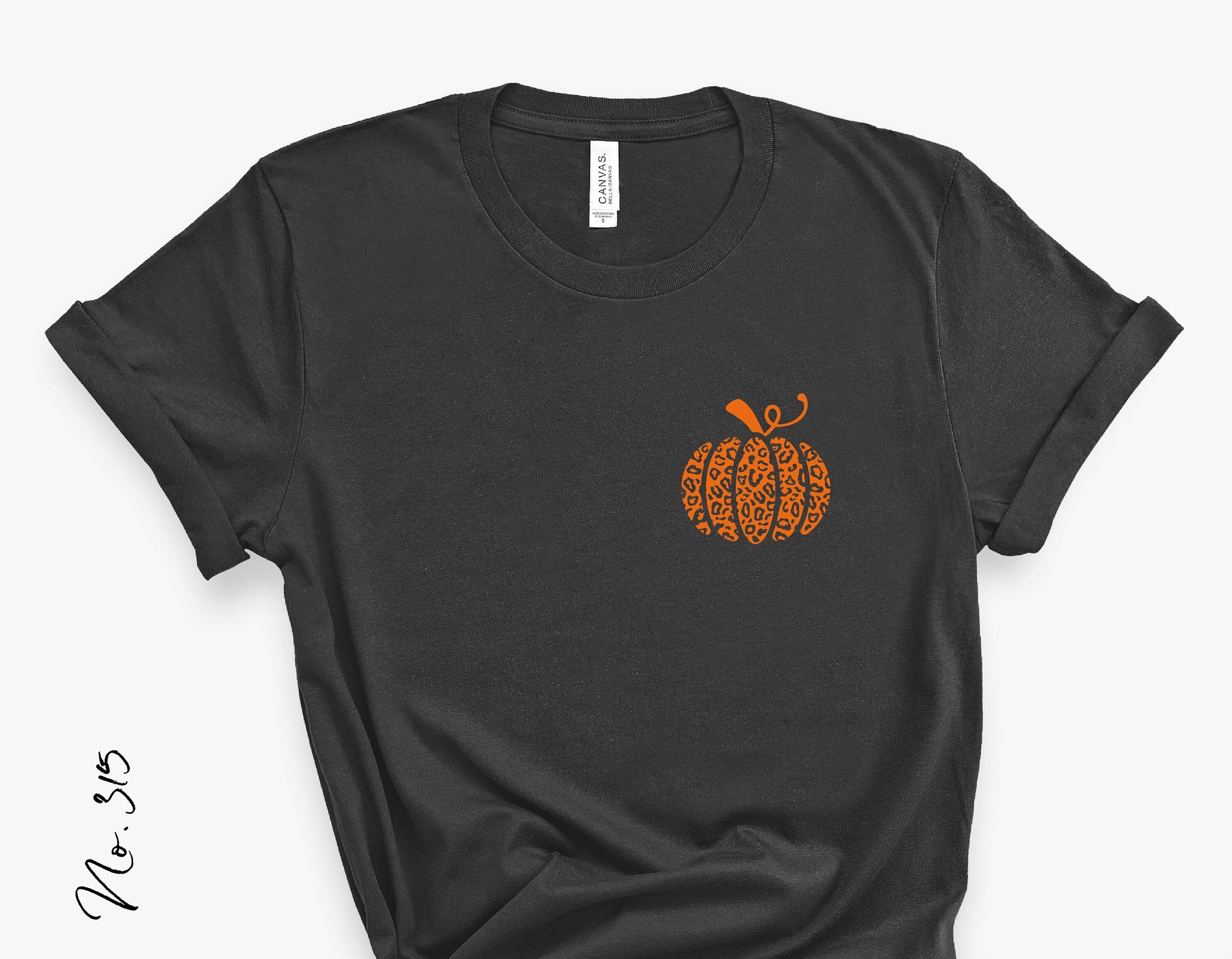 Black t-shirt featuring an orange leopard-patterned pumpkin design on the front, perfect for fall or Halloween.