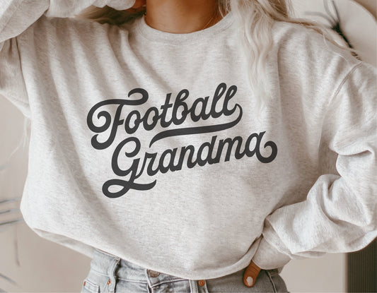 Vintage grey sweatshirt with 'Football Grandma' text in cursive, perfect for sports fans and DIY crafting with SVG and Cricut files.
